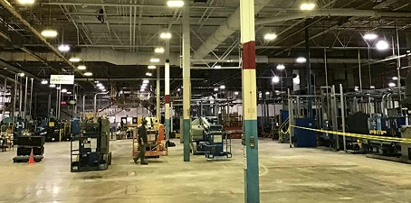 Steel and metal manufacturing cleaning—large factory floor with heavy equipment and open space after cleaning.