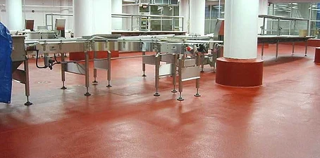 Restaurant painting—commercial kitchen area with red coated flooring and stainless steel equipment.